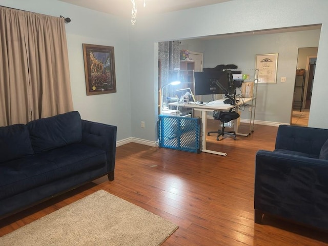 5167 Lafaye St, New Orleans, LA 70122 - living room featuring an office area and wood finished floors