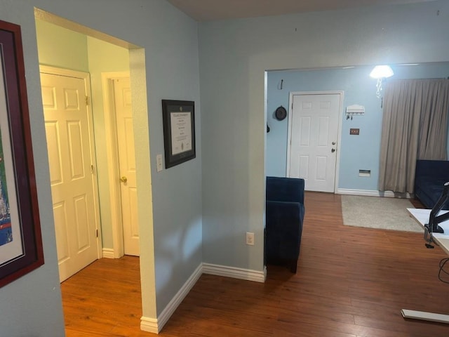 5167 Lafaye St, New Orleans, LA 70122 - hallway featuring wood finished floors and baseboards