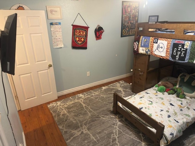 5167 Lafaye St, New Orleans, LA 70122 - bedroom with wood finished floors and baseboards