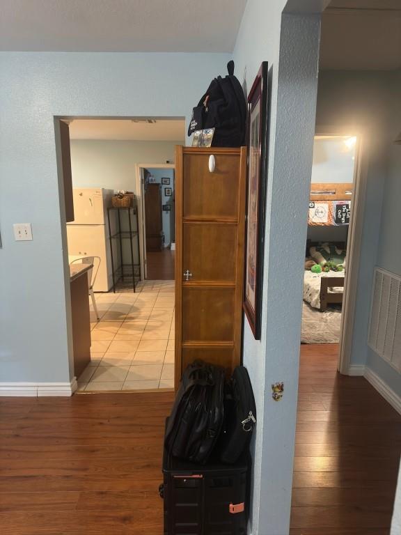 5167 Lafaye St, New Orleans, LA 70122 - corridor featuring wood finished floors