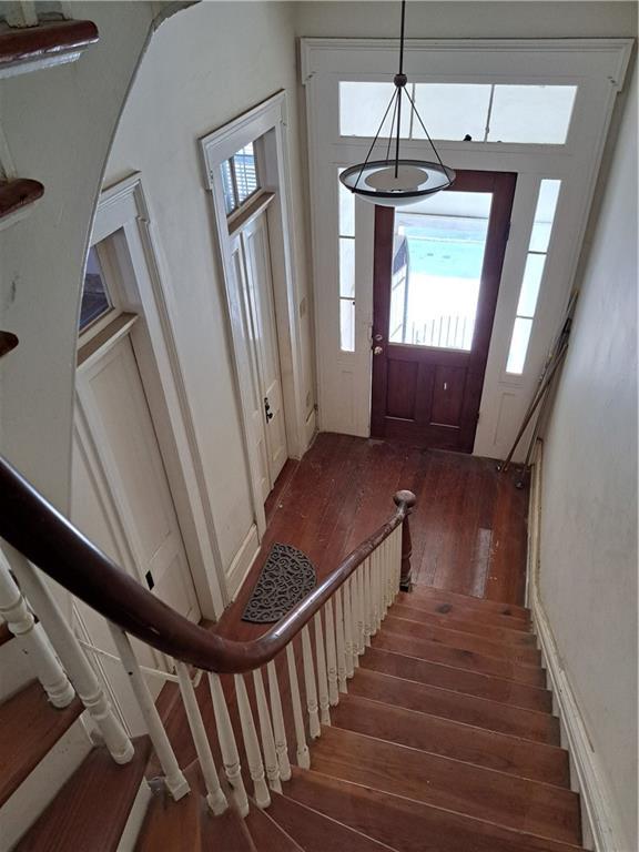 1131 Burgundy St Unit B, New Orleans, LA 70116 - entryway featuring stairs and hardwood / wood-style flooring