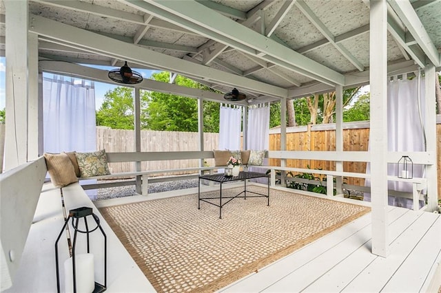 sunroom / solarium featuring an outdoor hangout area