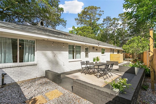 view of patio with outdoor dining area and a fenced backyard