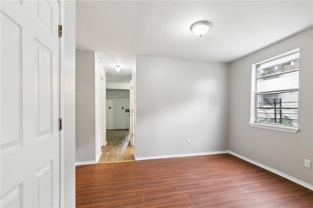 1772 N Dorgenois St, New Orleans, LA 70119 - empty room with baseboards and wood finished floors