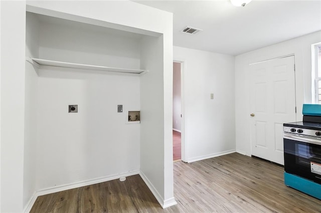 1772 N Dorgenois St, New Orleans, LA 70119 - washroom with laundry area, visible vents, wood finished floors, hookup for a washing machine, and electric dryer hookup