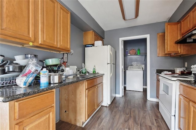 kitchen featuring washer / dryer, dark wood-style flooring, white appliances, dark stone counters, and under cabinet range hood