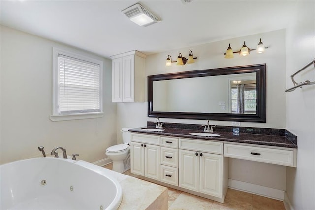 full bathroom with a sink, toilet, a tub with jets, and visible vents