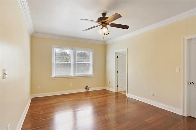 empty room featuring ceiling fan, ornamental molding, and wood finished floors