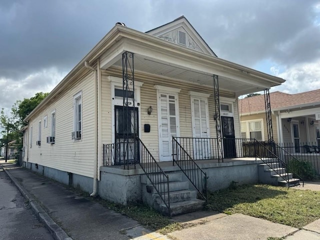 shotgun-style home with covered porch