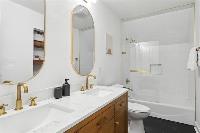 bathroom featuring tile patterned flooring, a sink, double vanity, and toilet