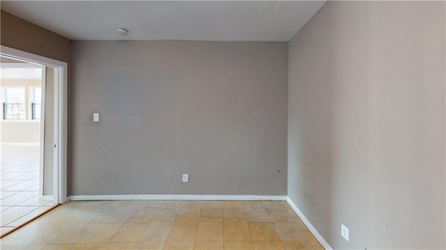 1336 Sere St, New Orleans, LA 70122 - spare room with baseboards and light tile patterned floors