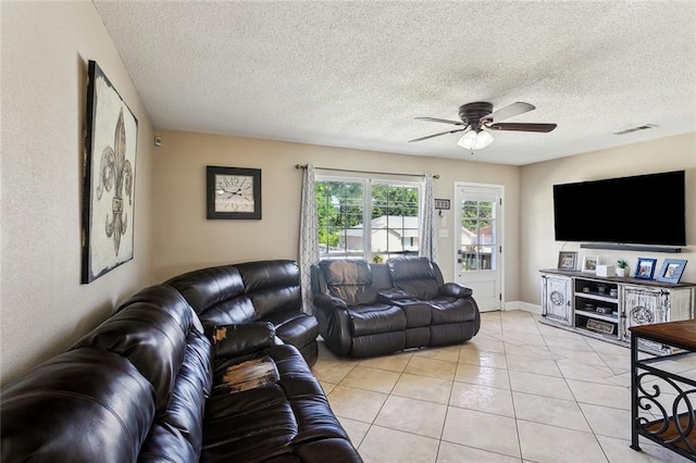 2967 Camellia Dr, Slidell, LA 70458 - living room with visible vents, a ceiling fan, a textured ceiling, and light tile patterned flooring