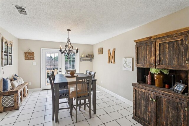 2967 Camellia Dr, Slidell, LA 70458 - dining room with visible vents, a textured ceiling, light tile patterned floors, and a notable chandelier