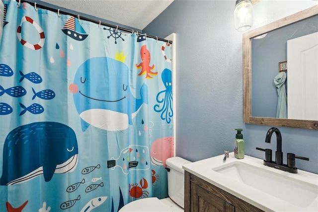 2967 Camellia Dr, Slidell, LA 70458 - bathroom featuring a textured wall, vanity, toilet, a textured ceiling, and a shower with curtain