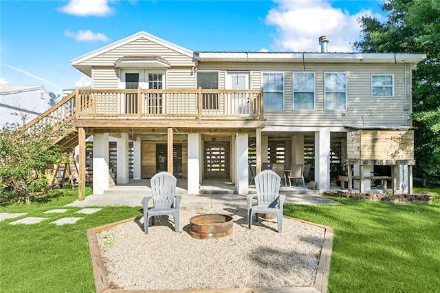 2967 Camellia Dr, Slidell, LA 70458 - back of house featuring a lawn, a wooden deck, an outdoor fire pit, a patio, and stairs