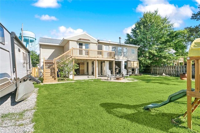 2967 Camellia Dr, Slidell, LA 70458 - back of property featuring fence, a deck, stairs, a patio area, and a lawn