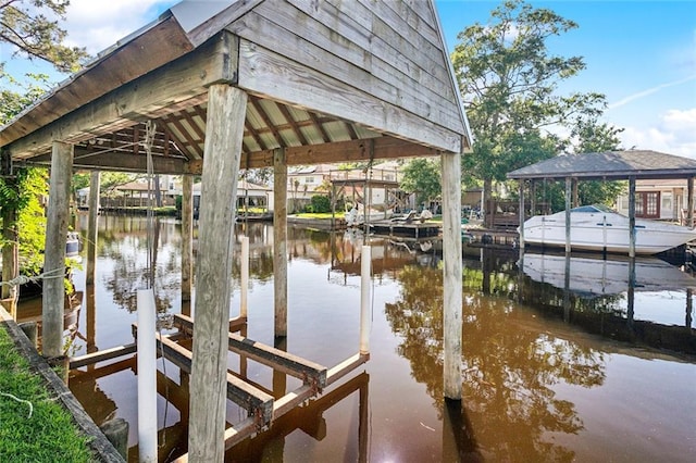 2967 Camellia Dr, Slidell, LA 70458 - view of dock featuring boat lift and a water view