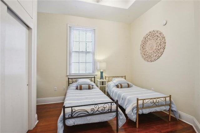 192426 Esplanade Ave, New Orleans, LA 70116 - bedroom with baseboards, wood finished floors, and a closet