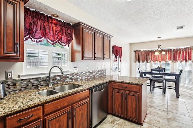 kitchen with a textured ceiling, visible vents, dishwasher, a sink, and stone countertops