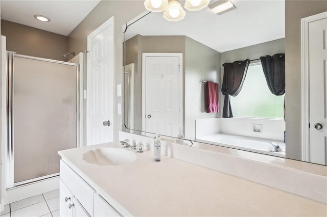 bathroom with vanity, tile patterned floors, a shower stall, and a bath
