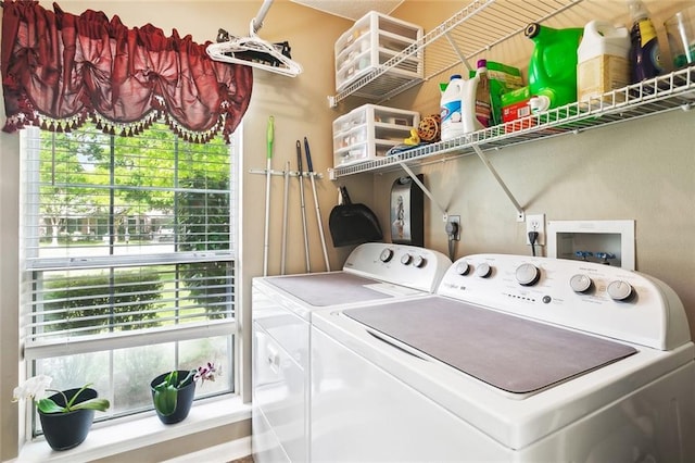 washroom with plenty of natural light, laundry area, and washer and dryer