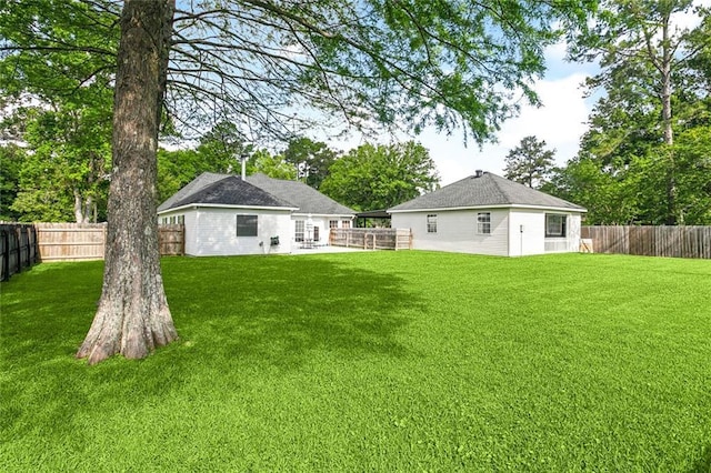 view of yard with a fenced backyard