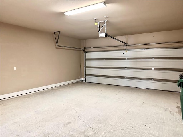 940 Woodsprings Ct, Covington, LA 70433 - garage with a garage door opener and baseboards
