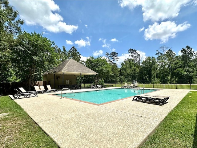 940 Woodsprings Ct, Covington, LA 70433 - community pool featuring a patio area and view of wooded area