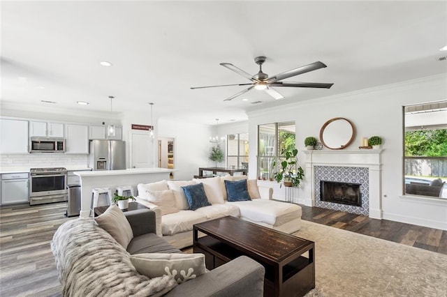 living area featuring a ceiling fan, recessed lighting, and a wealth of natural light
