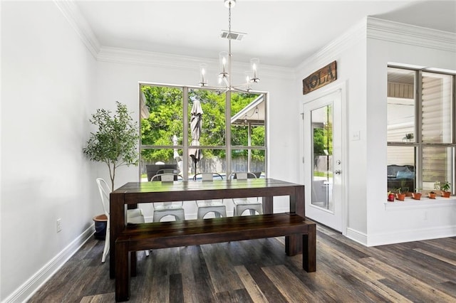 dining space featuring baseboards, visible vents, an inviting chandelier, and wood finished floors