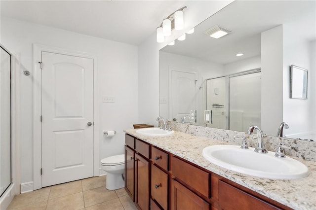 full bathroom with a sink, a shower stall, and visible vents
