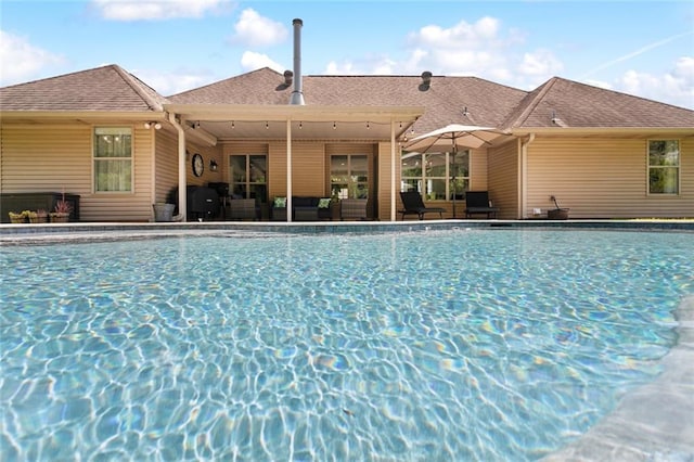 outdoor pool featuring an outdoor living space