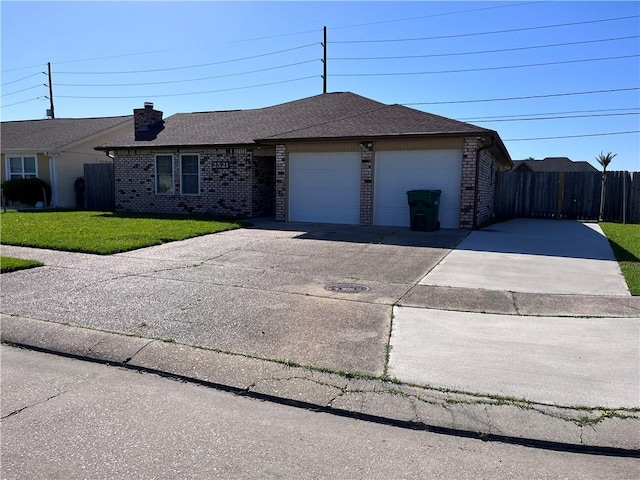 single story home with concrete driveway, brick siding, an attached garage, and a front lawn