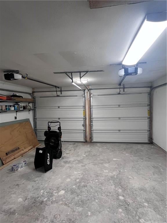 garage featuring a garage door opener
