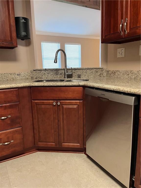 kitchen with a sink, crown molding, stainless steel dishwasher, and light stone countertops