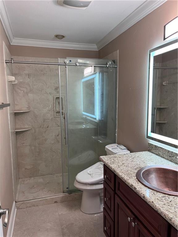 full bathroom featuring vanity, ornamental molding, a stall shower, and toilet