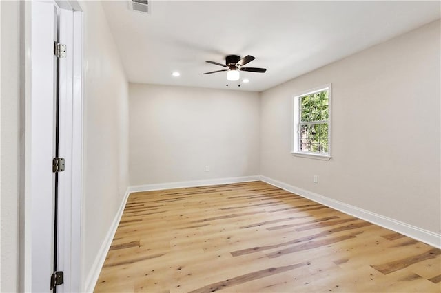 spare room featuring baseboards, ceiling fan, recessed lighting, and light wood-style flooring
