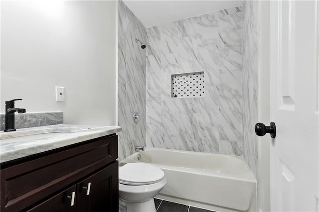 bathroom featuring vanity, tile patterned floors, tub / shower combination, and toilet