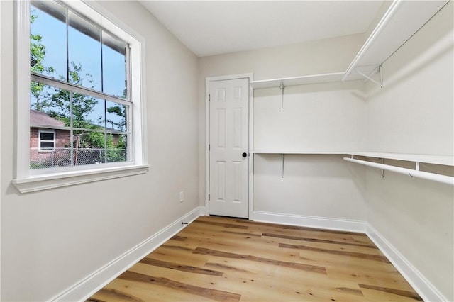 spacious closet featuring wood finished floors