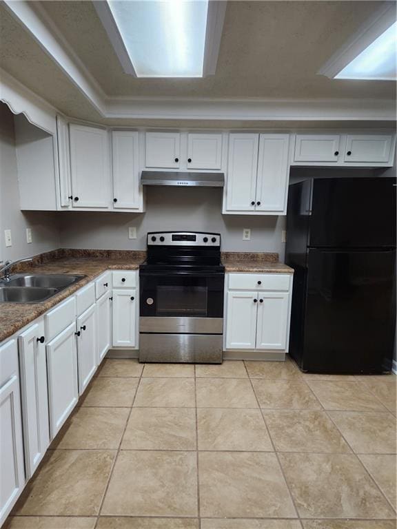 kitchen with a sink, freestanding refrigerator, electric stove, under cabinet range hood, and white cabinetry