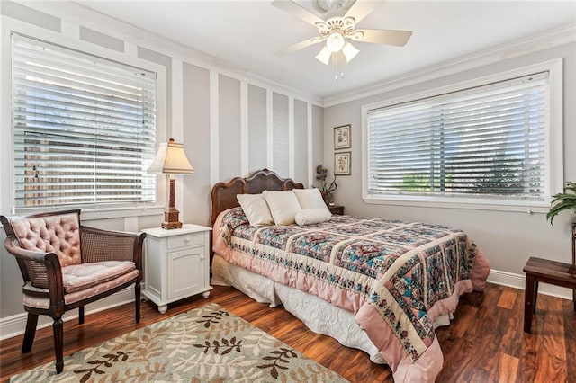 bedroom with crown molding, baseboards, ceiling fan, and wood finished floors