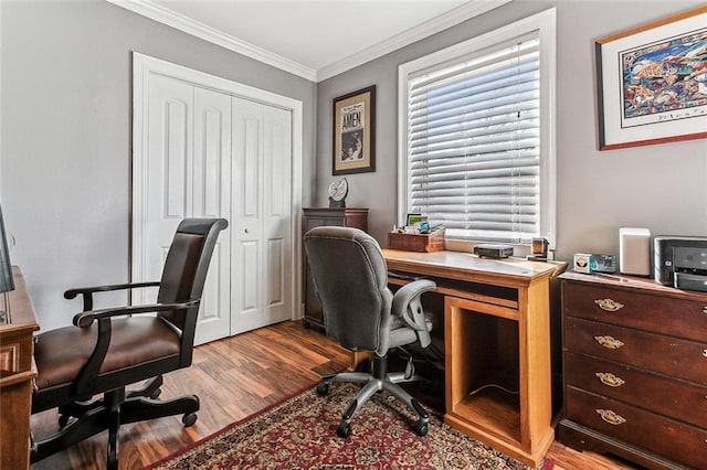 home office with crown molding and wood finished floors