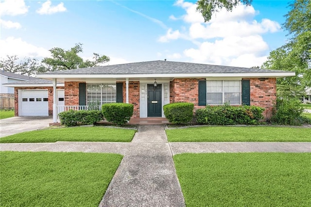 ranch-style home featuring an attached garage, a front yard, and brick siding