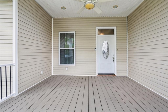 doorway to property featuring a ceiling fan