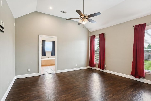 unfurnished room featuring visible vents, ceiling fan, vaulted ceiling, and a wealth of natural light