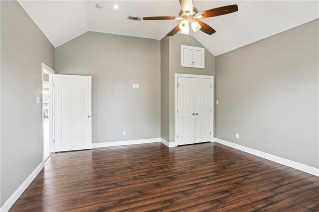 204 Doerr Dr, Arabi, LA 70032 - spare room with ceiling fan, dark wood-style floors, baseboards, and high vaulted ceiling
