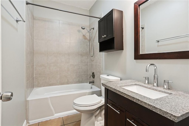 bathroom featuring vanity, tile patterned flooring, toilet, and tub / shower combination