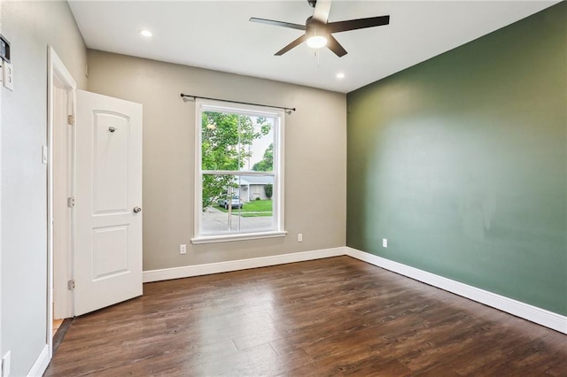 spare room featuring baseboards, a ceiling fan, recessed lighting, and wood finished floors