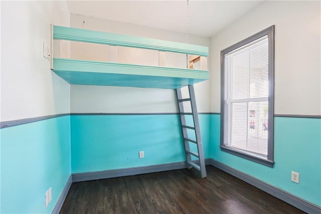 204 Doerr Dr, Arabi, LA 70032 - empty room with wood finished floors and baseboards