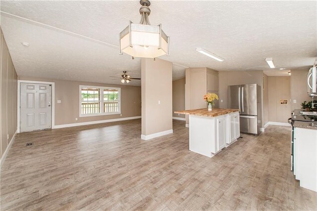 32536 D Wascom Rd, Mount Hermon, LA 70450 - kitchen featuring stainless steel appliances, a textured ceiling, ceiling fan, and butcher block counters